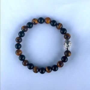 Buddha head with tiger eyes elastic can fit also 7 inches wrist hand too